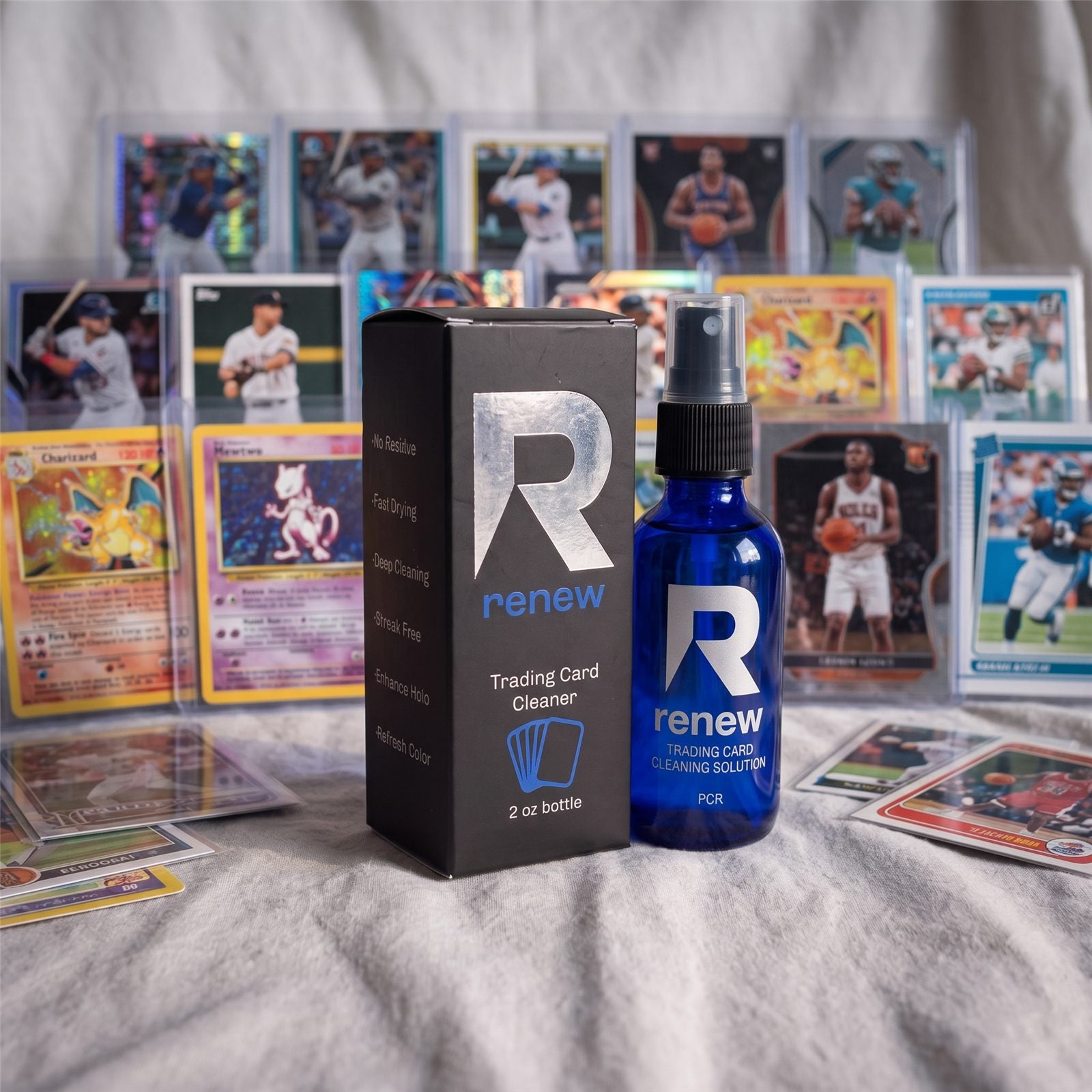 The Renew bottle and box standing among sleeved Pokemon, basketball and baseball cards